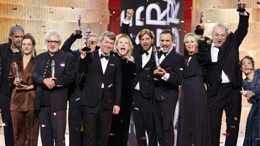 A group of people receiving a film award